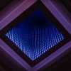 A captivating abstract view of a LED infinity mirror with vibrant light patterns.